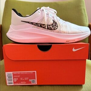 Nike White and Black Zoom Sneakers with Leopard Swoosh